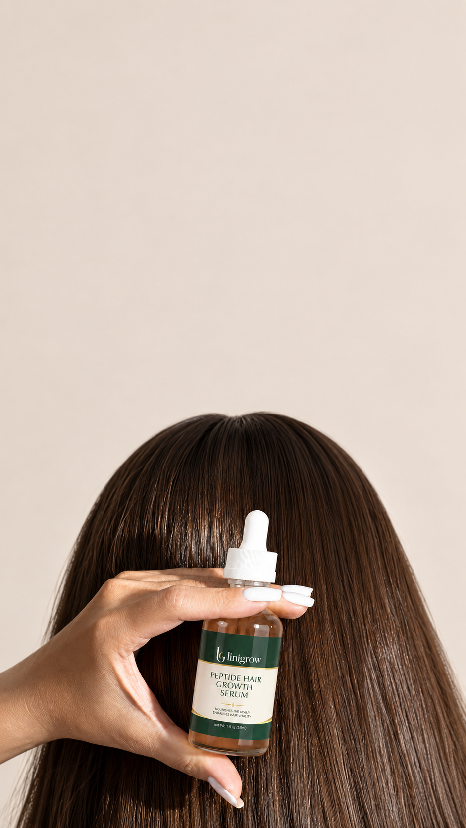 LINIGROW Peptide Hair Growth Serum bottle held in soft natural light