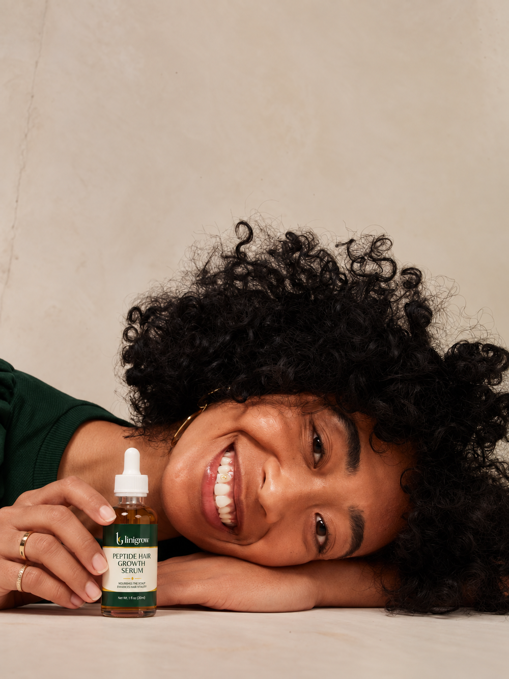 LINIGROW serum bottle styled on a calm neutral surface